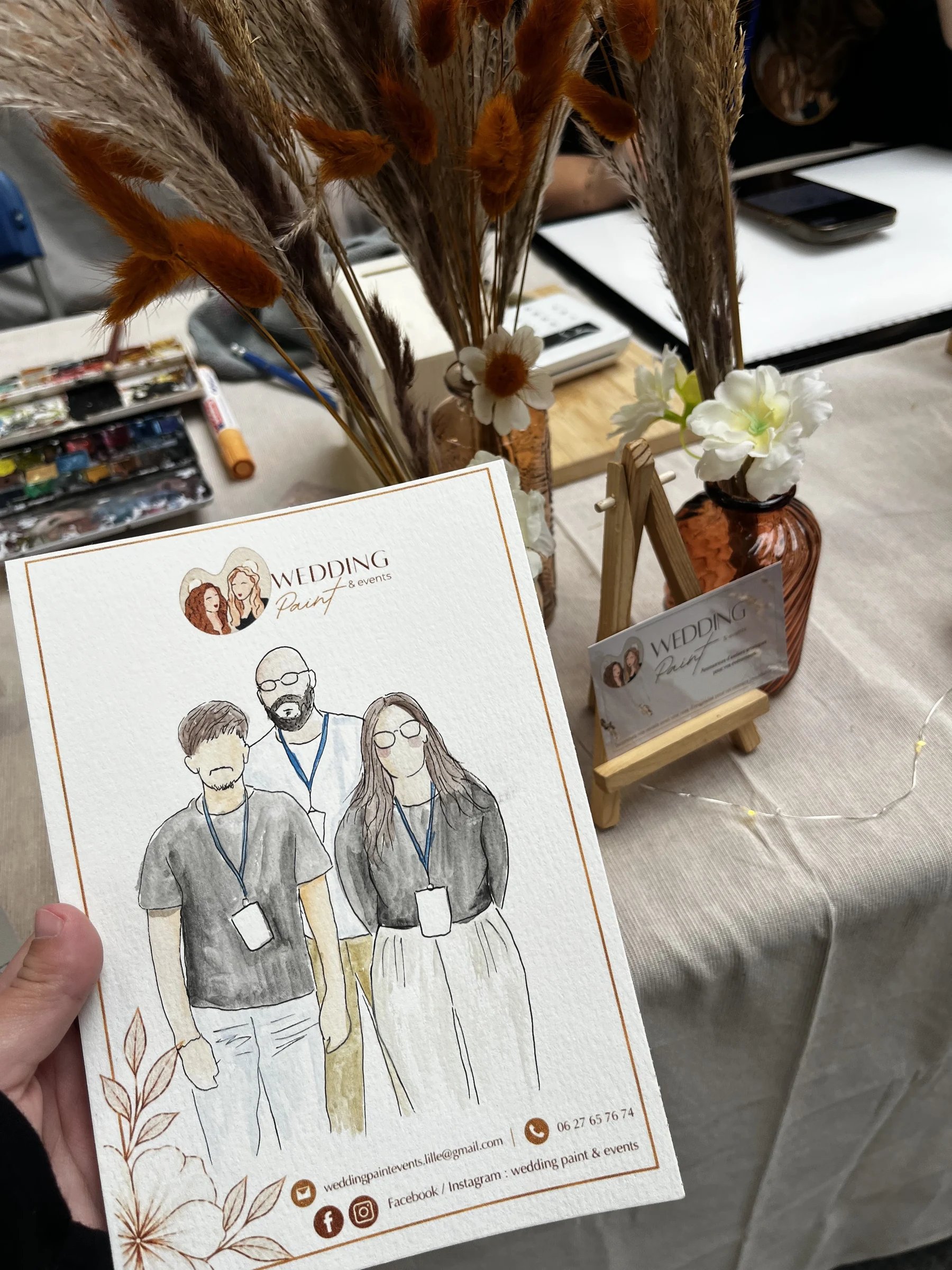 Portrait à l'aquarelle de l'équipe Photora, peint en direct par Wedding Paint & Events